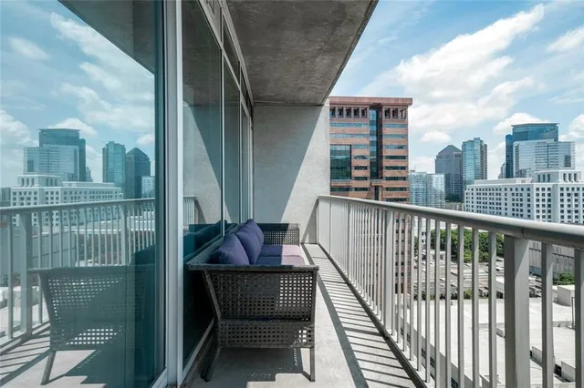 a view of balcony with furniture