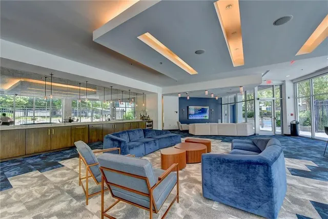 a living room with furniture and a large window