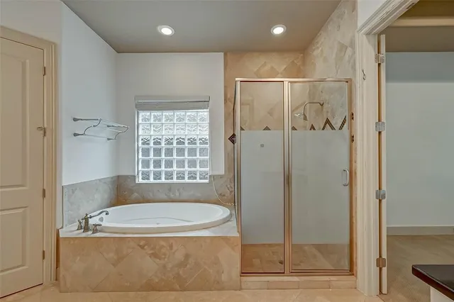 a bathroom with a granite countertop sink a toilet a mirror and shower