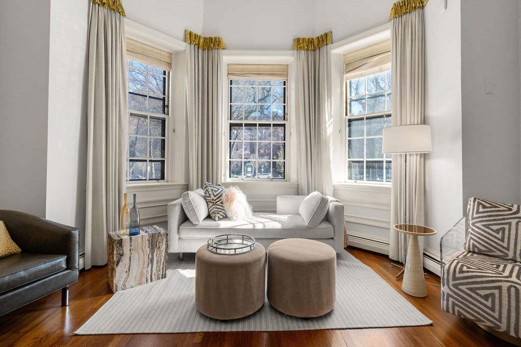 113 Commonwealth Avenue, Unit 3 Boston, MA 02116 - Photo 13 of 30 a living room with furniture and a window
