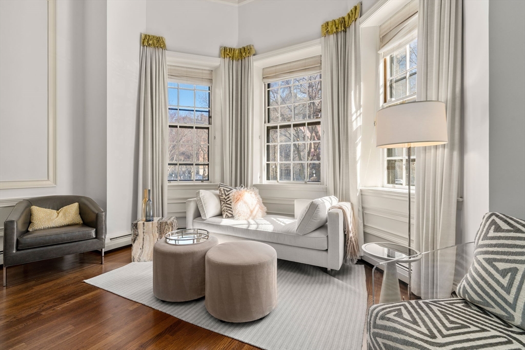 113 Commonwealth Avenue, Unit 3 Boston, MA 02116 - Photo 14 of 30 a living room with furniture and a window