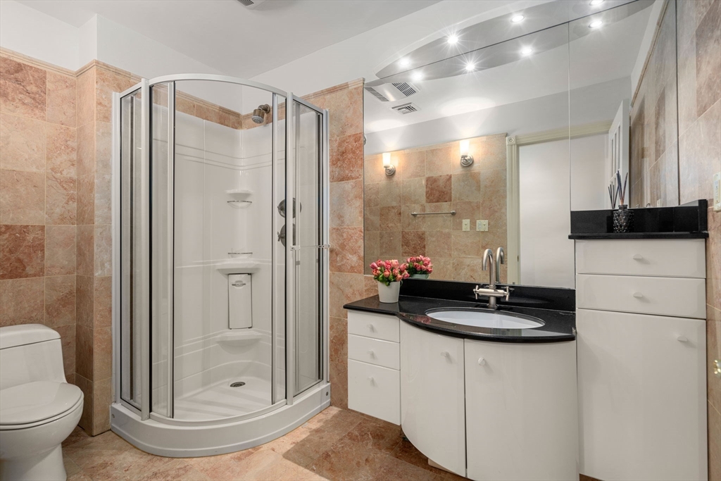 113 Commonwealth Avenue, Unit 3 Boston, MA 02116 - Photo 20 of 30 a bathroom with a sink a toilet and a shower