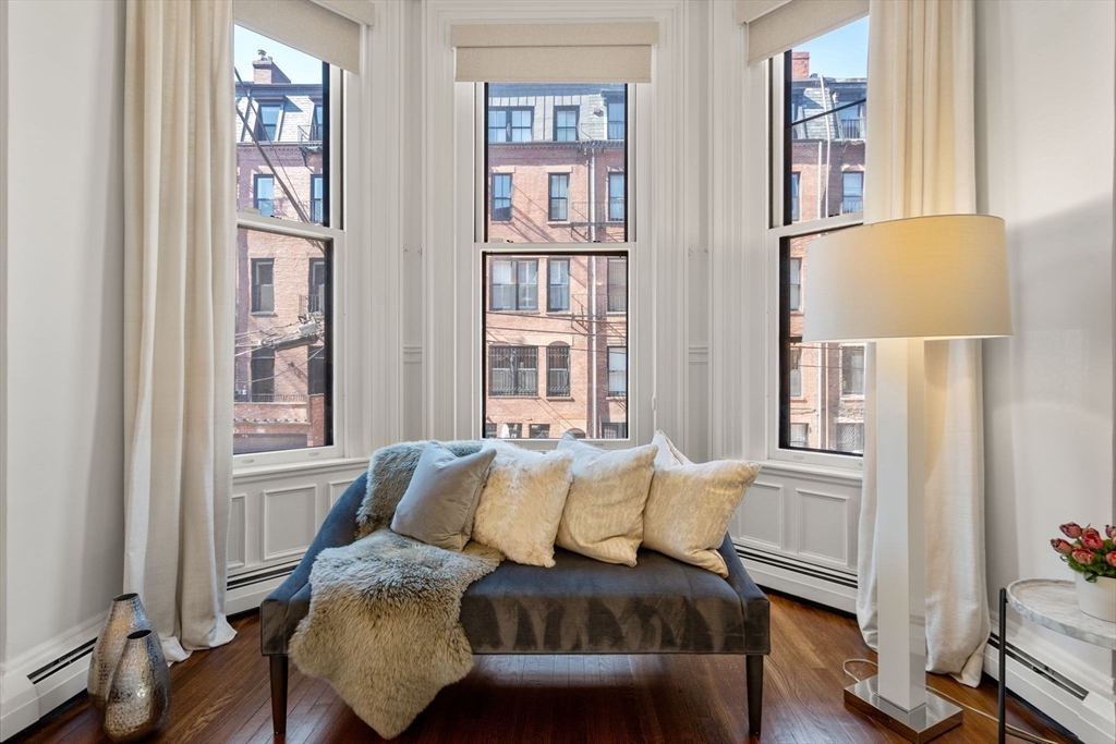 113 Commonwealth Avenue, Unit 3 Boston, MA 02116 - Photo 23 of 30 a living room with furniture and a window