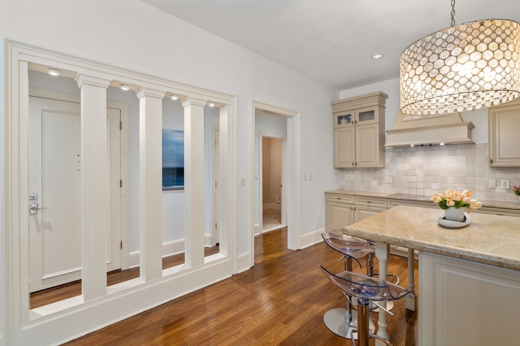 113 Commonwealth Avenue, Unit 3 Boston, MA 02116 - Photo 5 of 30 a kitchen with a sink and a stove top oven