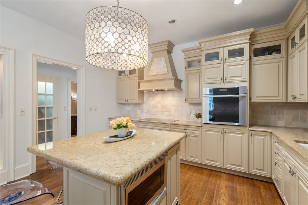 113 Commonwealth Avenue, Unit 3 Boston, MA 02116 - Photo 6 of 30 a kitchen with stainless steel appliances granite countertop a sink and cabinets