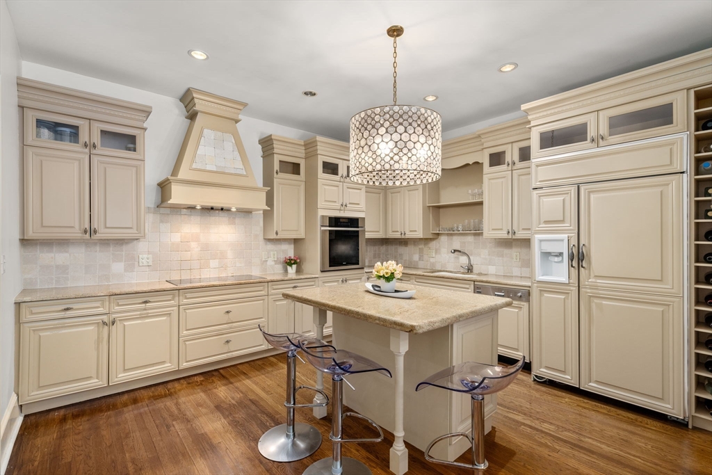 113 Commonwealth Avenue, Unit 3 Boston, MA 02116 - Photo 7 of 30 an open kitchen with a sink stainless steel appliances and cabinets