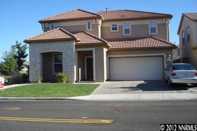 501 Needles Court Reno, NV 89521 - Photo 1 of 1 a front view of a house with a yard and garage