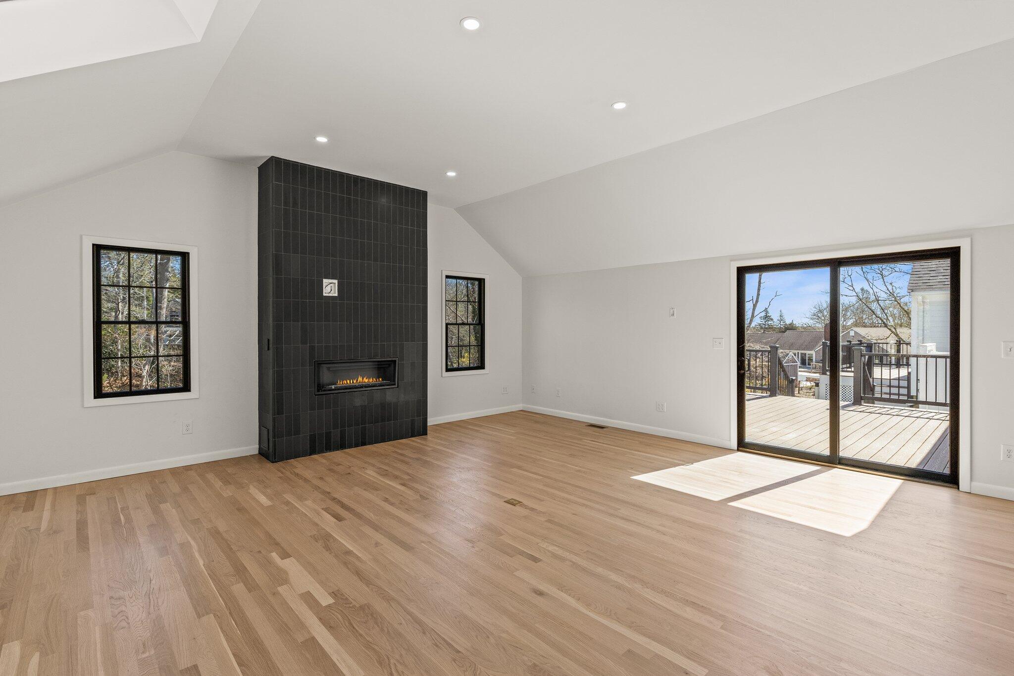 101 Monomoyic Way Chatham, MA 02633 - Photo 15 of 59 a view of an empty room with glass door