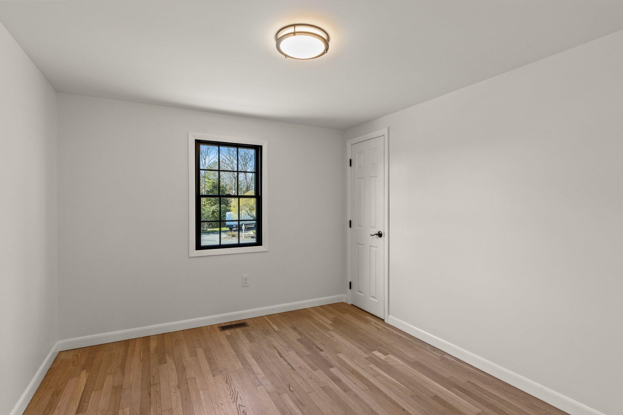 101 Monomoyic Way Chatham, MA 02633 - Photo 18 of 59 an empty room with a window