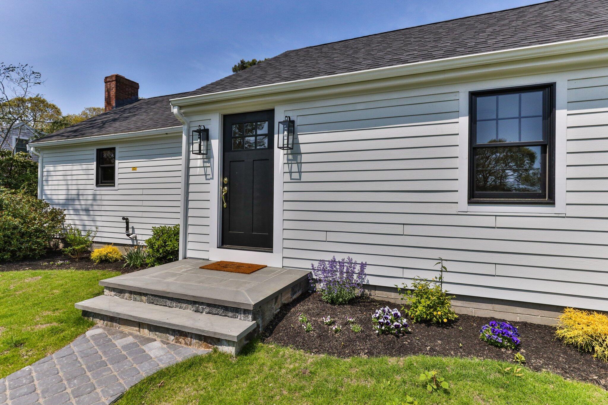 101 Monomoyic Way Chatham, MA 02633 - Photo 2 of 59 a view of a house with backyard and sitting area