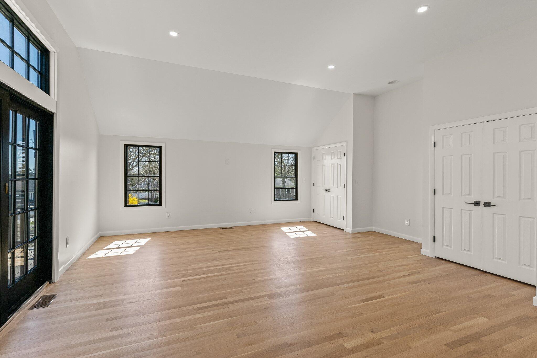 101 Monomoyic Way Chatham, MA 02633 - Photo 25 of 59 a view of an empty room with wooden floor