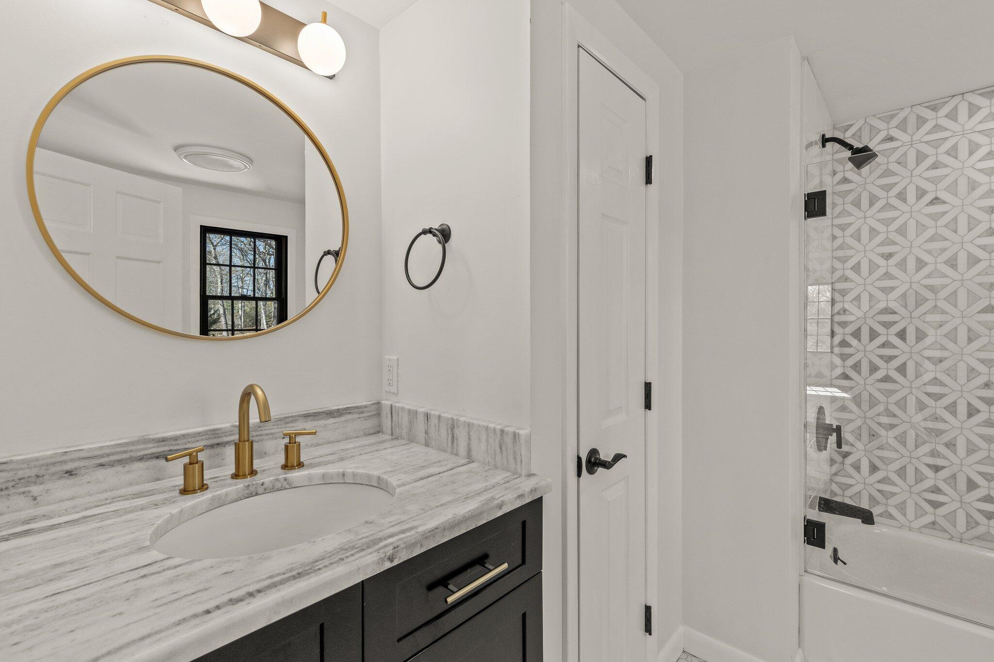 101 Monomoyic Way Chatham, MA 02633 - Photo 28 of 59 a bathroom with a sink and a mirror