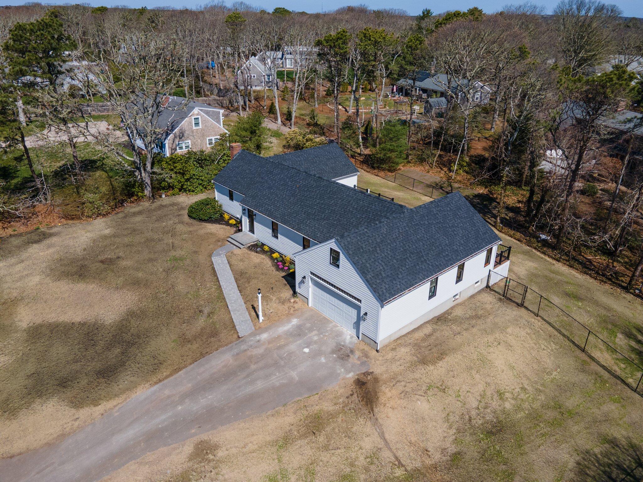 101 Monomoyic Way Chatham, MA 02633 - Photo 43 of 59 an aerial view of residential houses with outdoor space