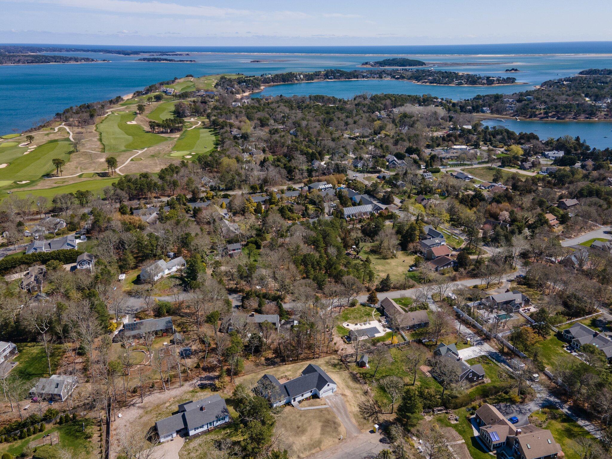 101 Monomoyic Way Chatham, MA 02633 - Photo 51 of 59 a view of a large body of water with a building in the background