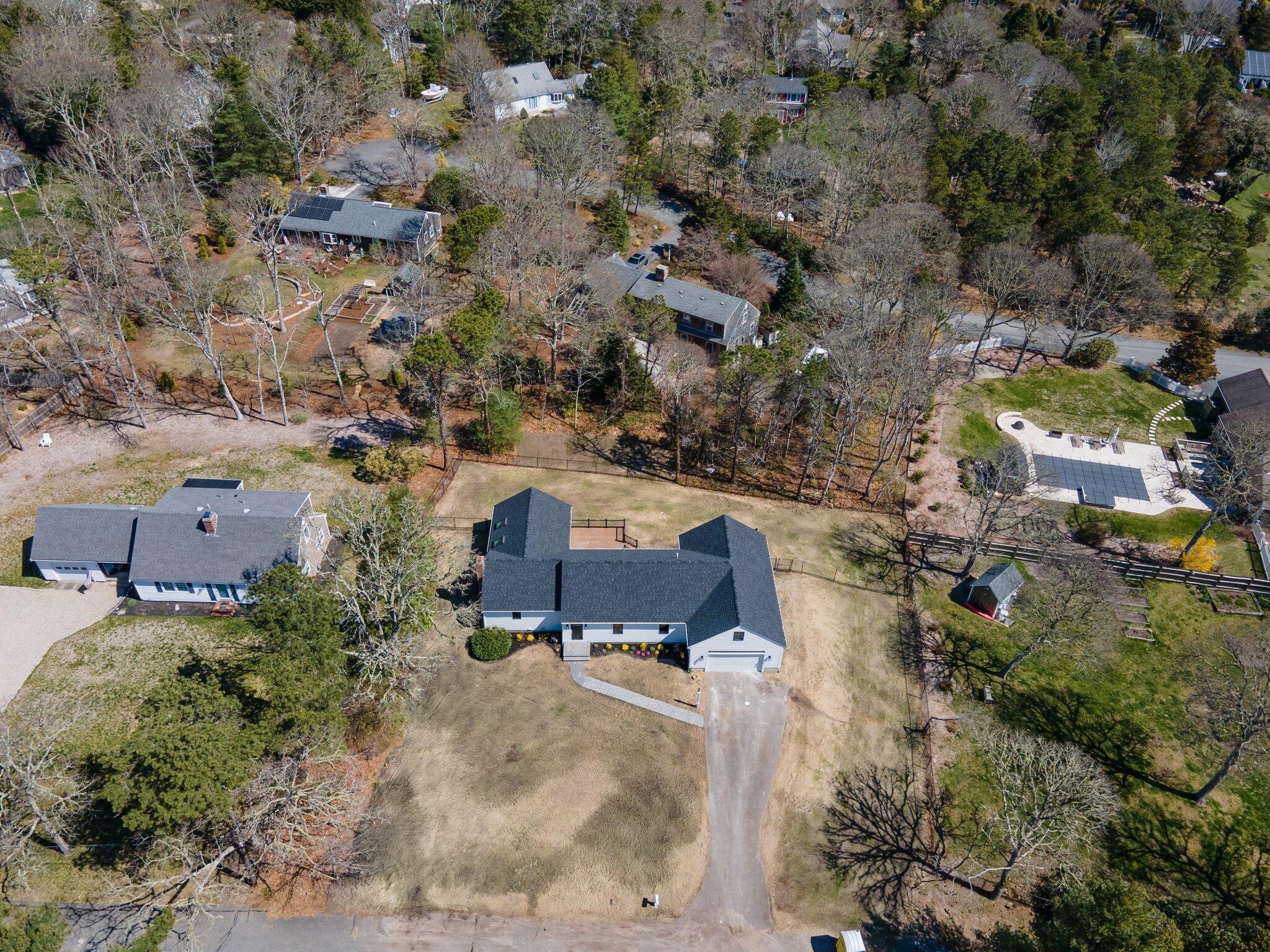 101 Monomoyic Way Chatham, MA 02633 - Photo 52 of 59 an aerial view of a house with a yard and lake view