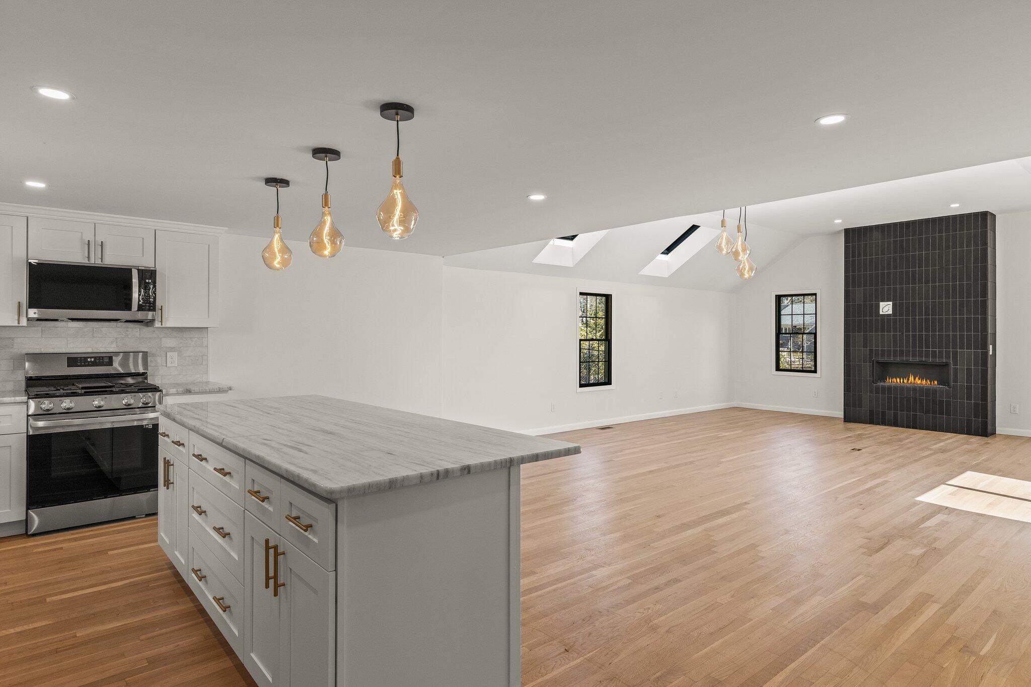101 Monomoyic Way Chatham, MA 02633 - Photo 10 of 59 a kitchen with a stove and a kitchen island