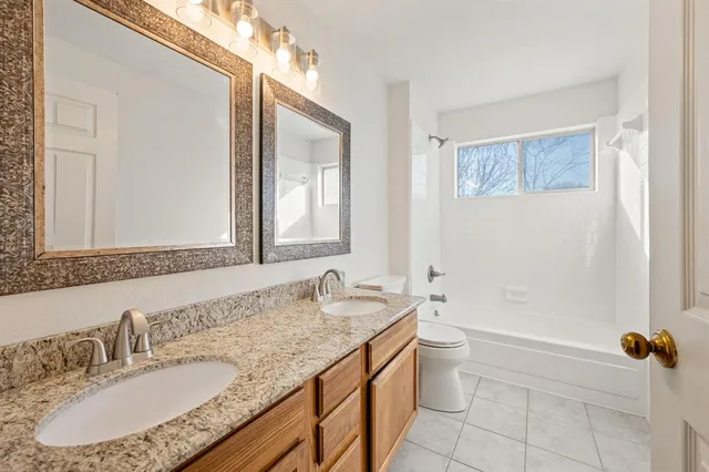 a view of a big room with wooden floor closet and windows