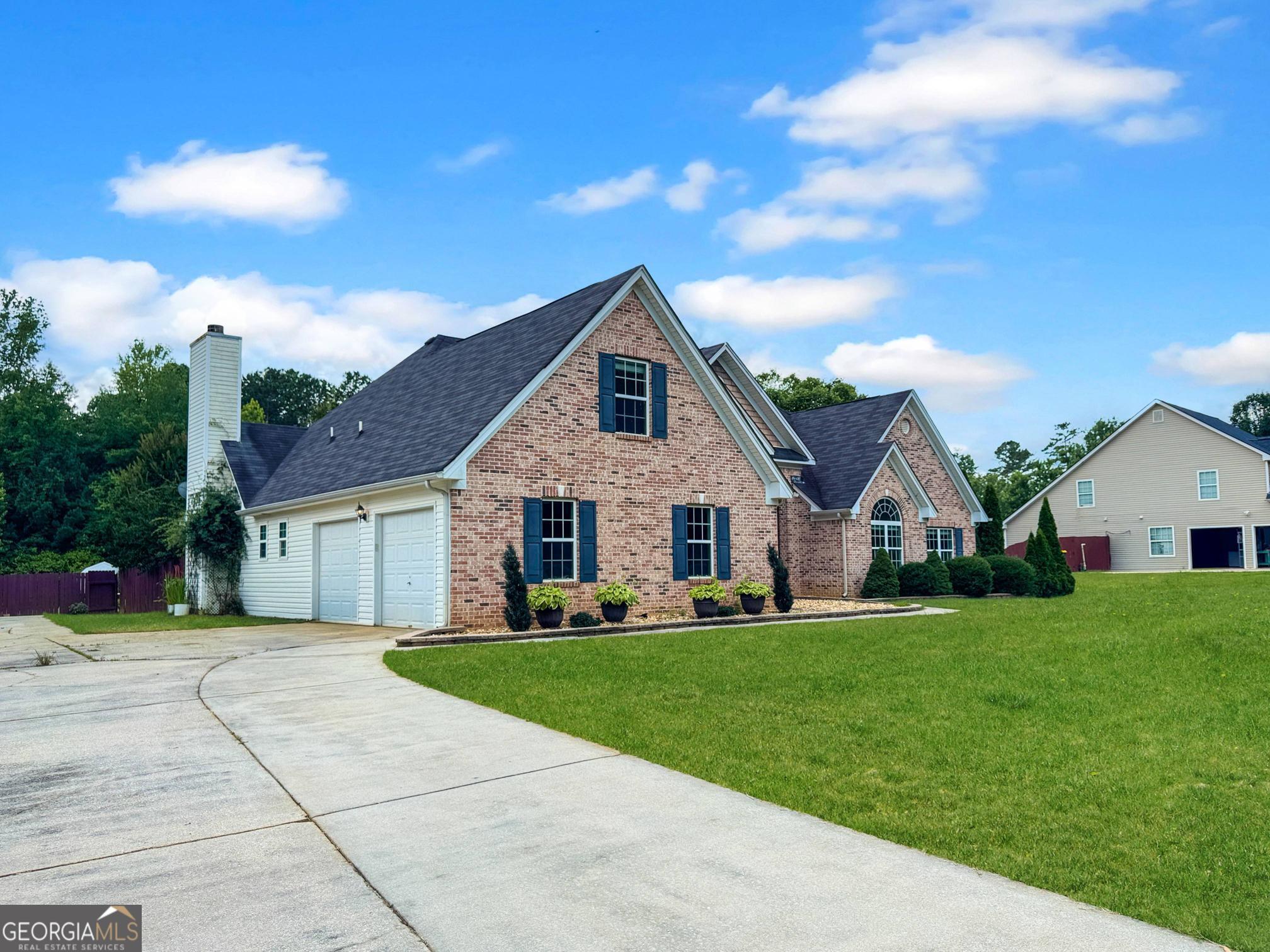 2022 Standing Rock Road Senoia, GA 30276 - Photo 11 of 36 a front view of house with yard and green space