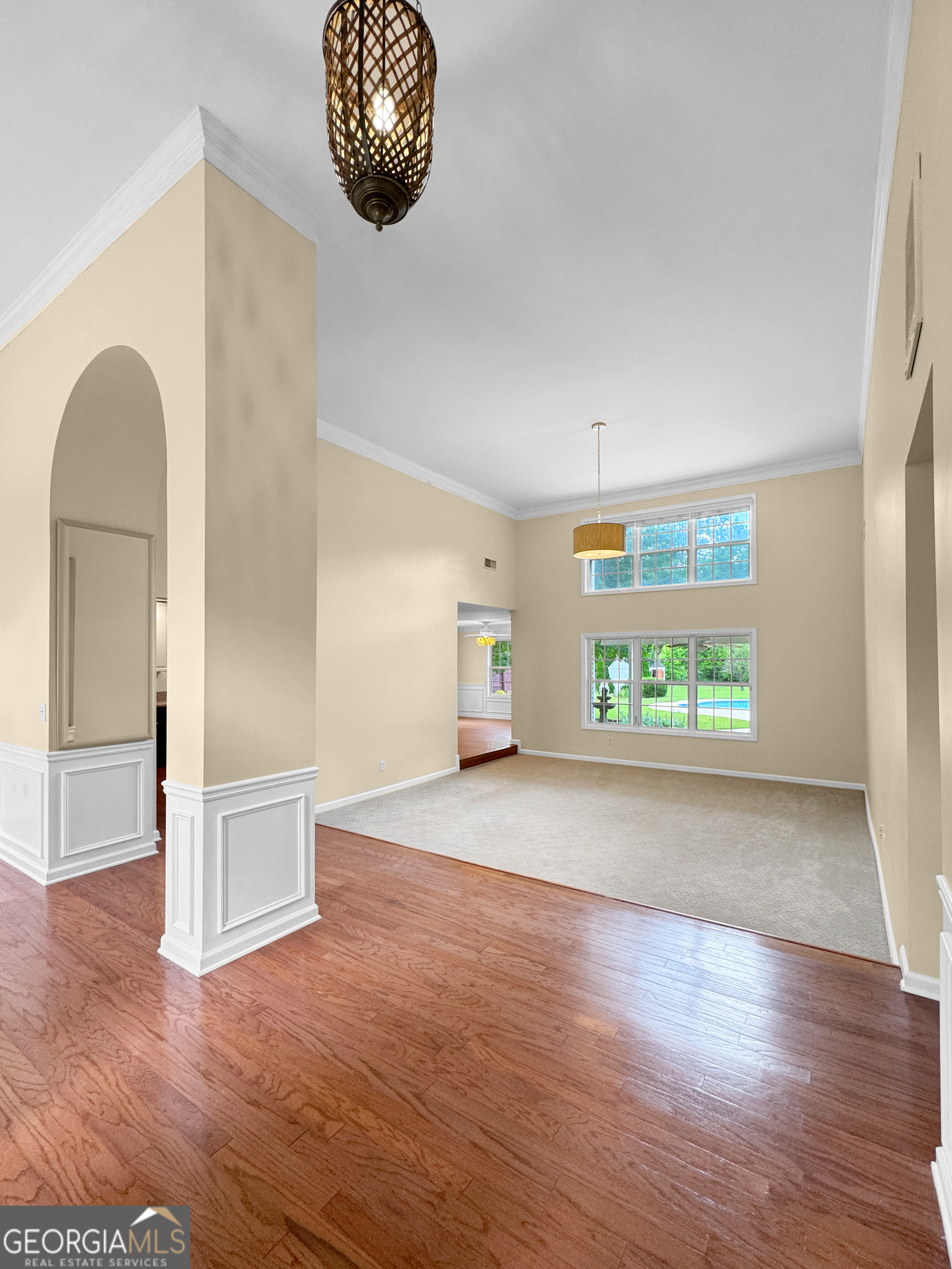 2022 Standing Rock Road Senoia, GA 30276 - Photo 12 of 36 an empty room with wooden floor and windows