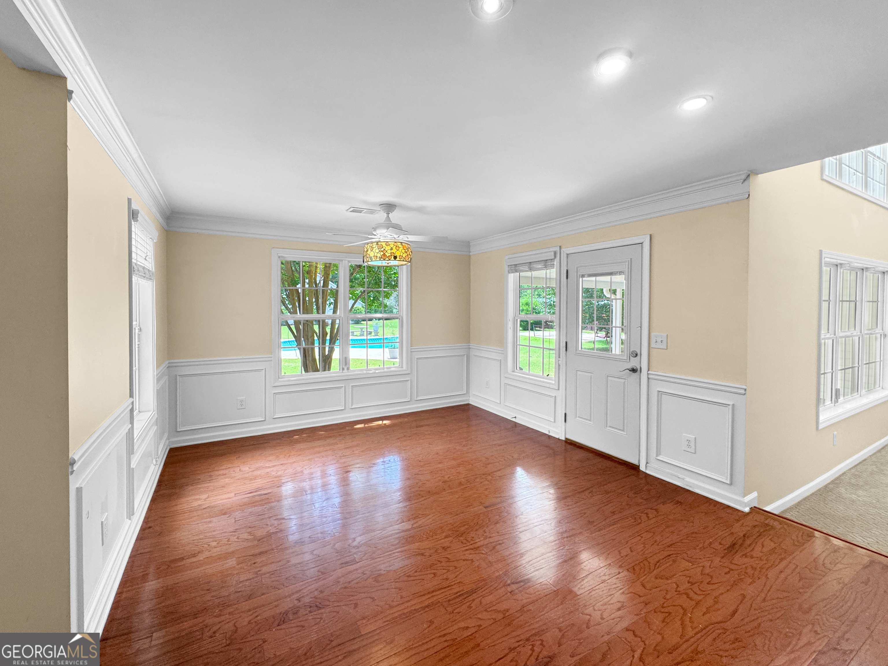 2022 Standing Rock Road Senoia, GA 30276 - Photo 18 of 36 an empty room with wooden floor and windows