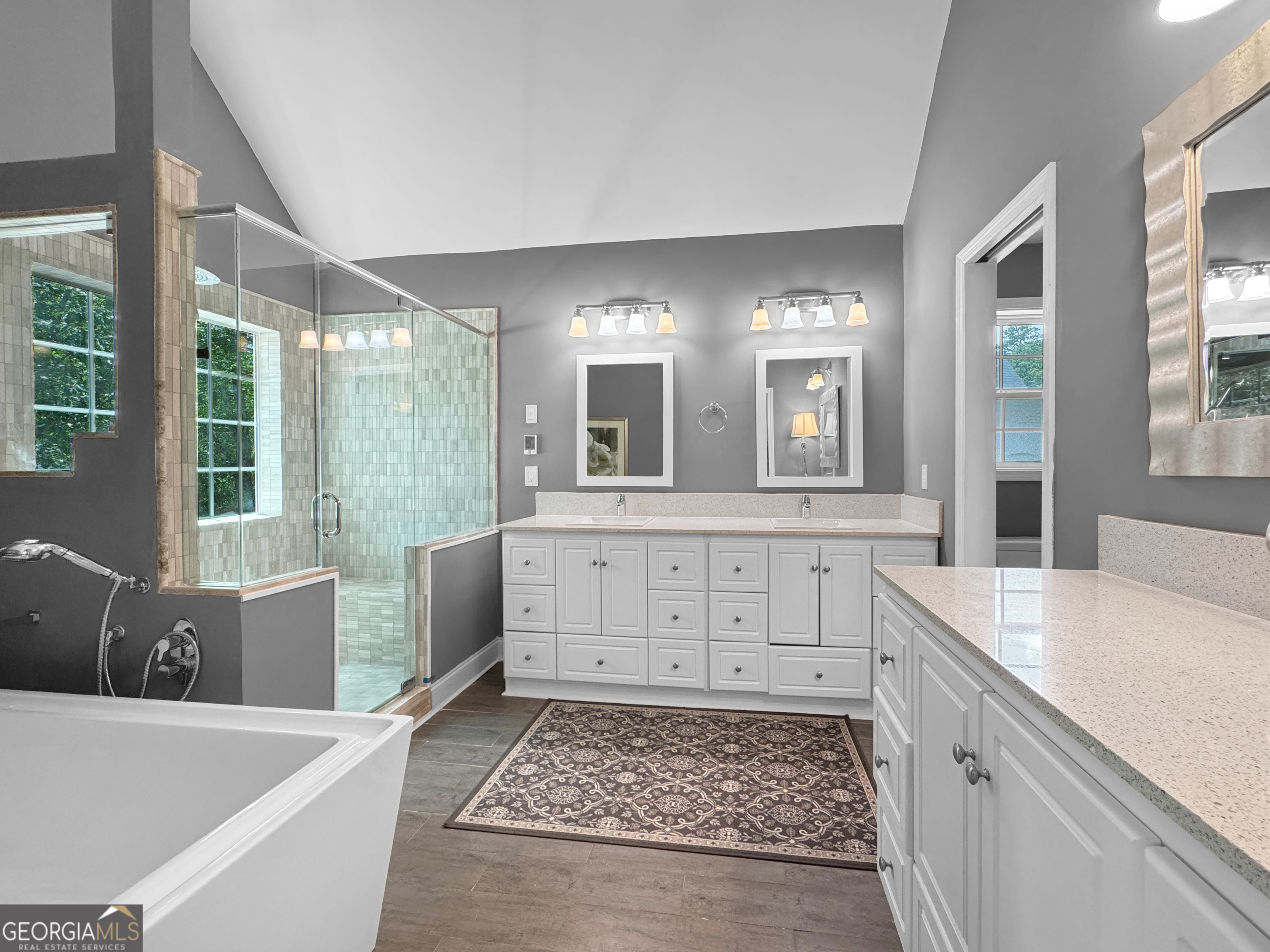 2022 Standing Rock Road Senoia, GA 30276 - Photo 24 of 36 a bathroom with a tub sink and mirror