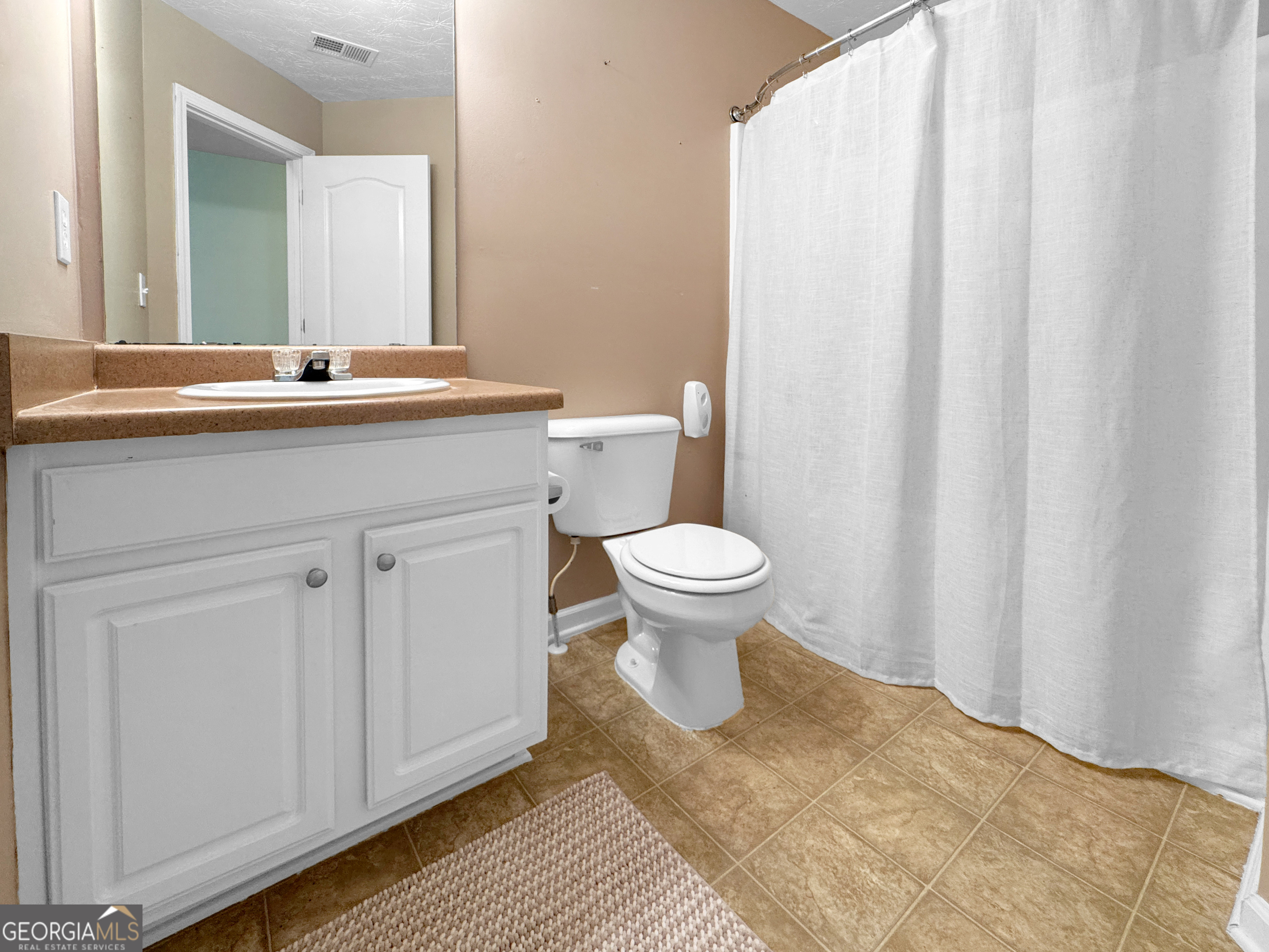 2022 Standing Rock Road Senoia, GA 30276 - Photo 35 of 36 a bathroom with a sink toilet and shower