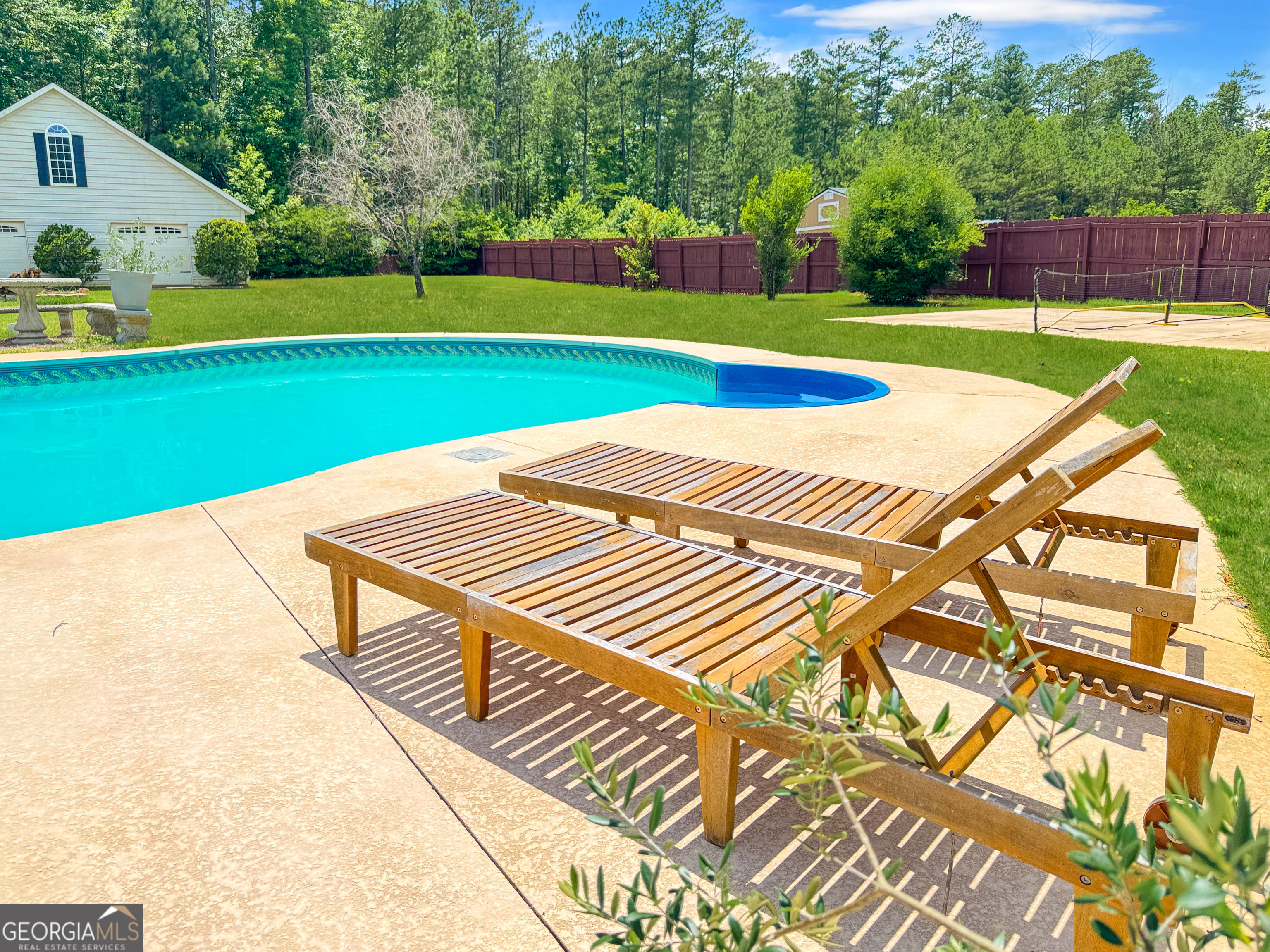 2022 Standing Rock Road Senoia, GA 30276 - Photo 7 of 36 a view of a backyard with swimming pool