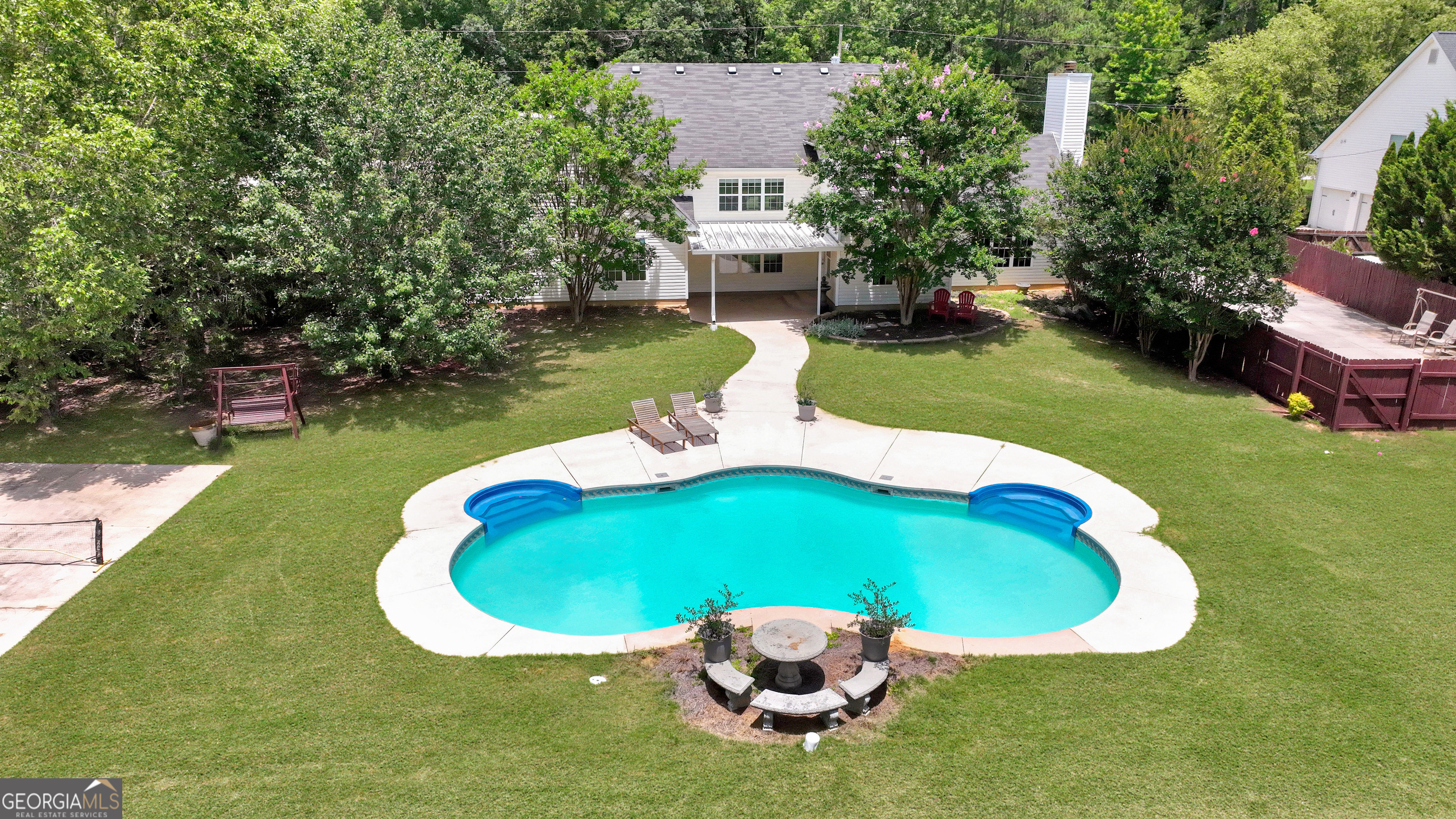 2022 Standing Rock Road Senoia, GA 30276 - Photo 8 of 36 a view of a swimming pool with a yard