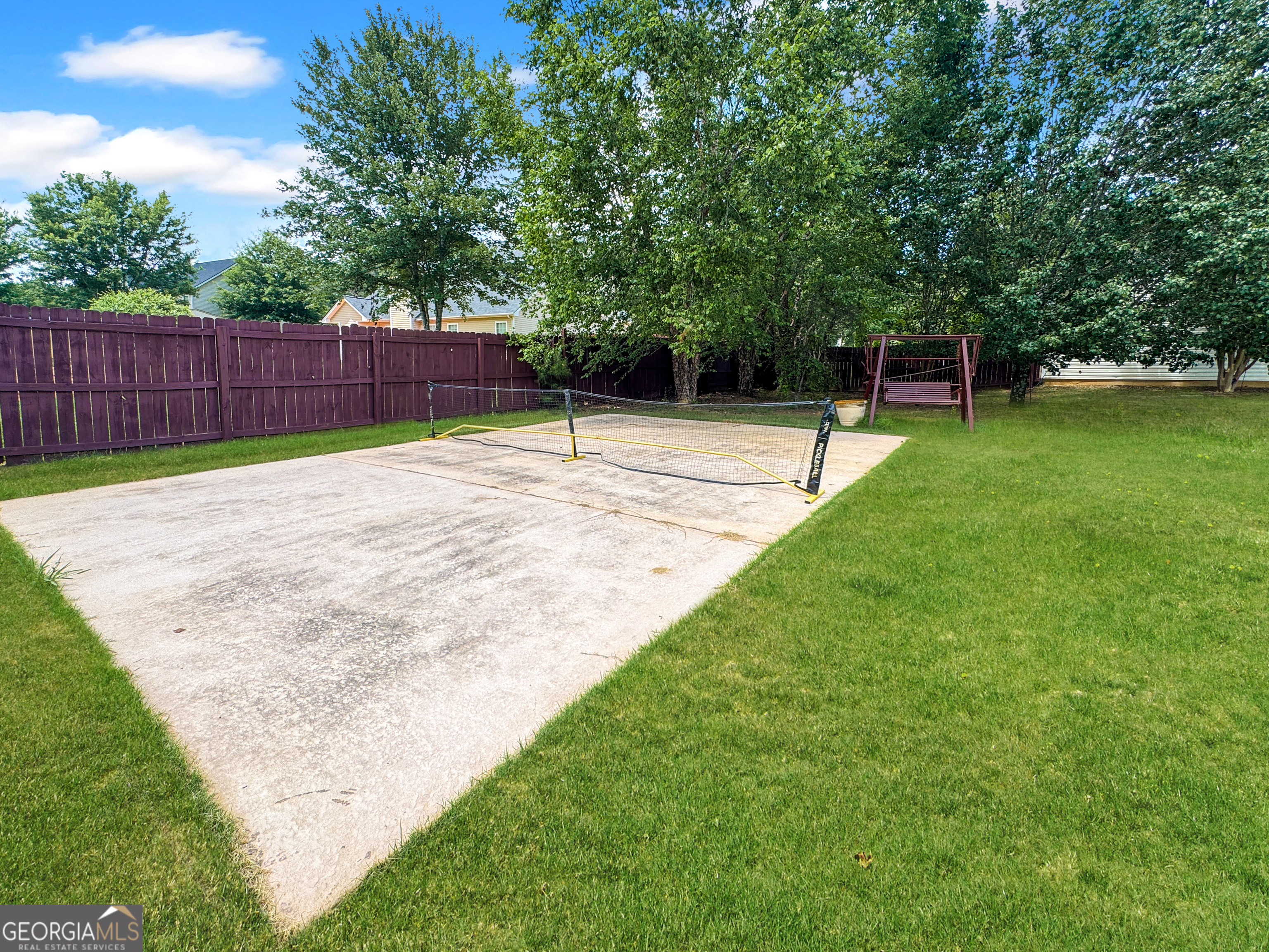 2022 Standing Rock Road Senoia, GA 30276 - Photo 9 of 36 a swimming pool with wooden fence