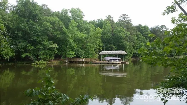 a view of a lake with a house in the background