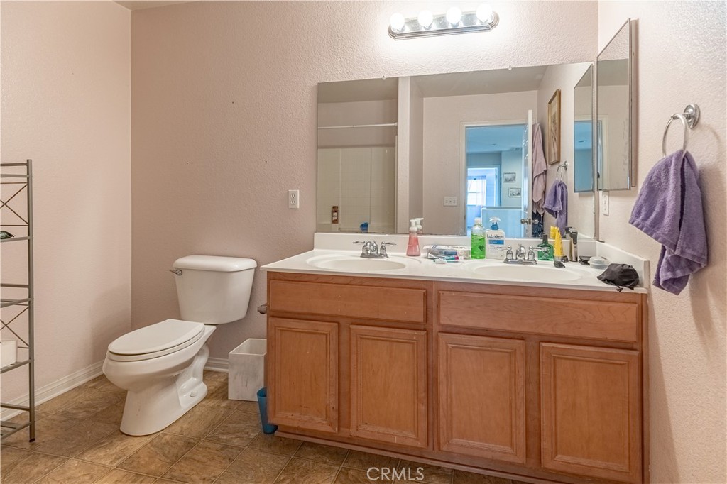 9131 Santa Barbara Drive Riverside, CA 92508 - Photo 17 of 29 a bathroom with a sink and a toilet
