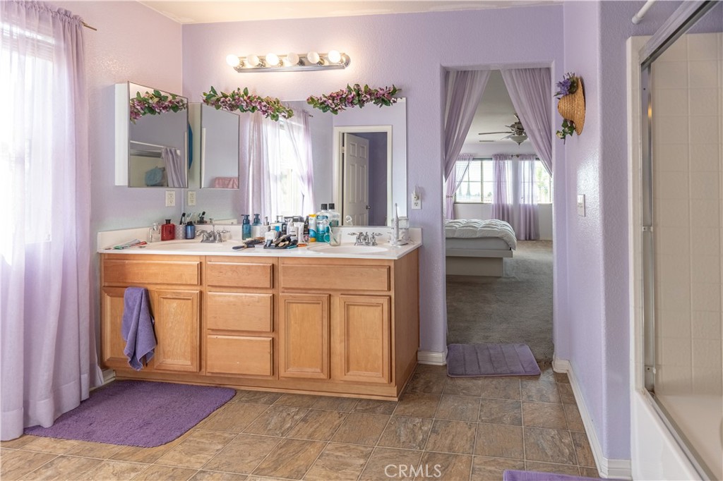 9131 Santa Barbara Drive Riverside, CA 92508 - Photo 18 of 29 a bathroom with a sink vanity and mirror