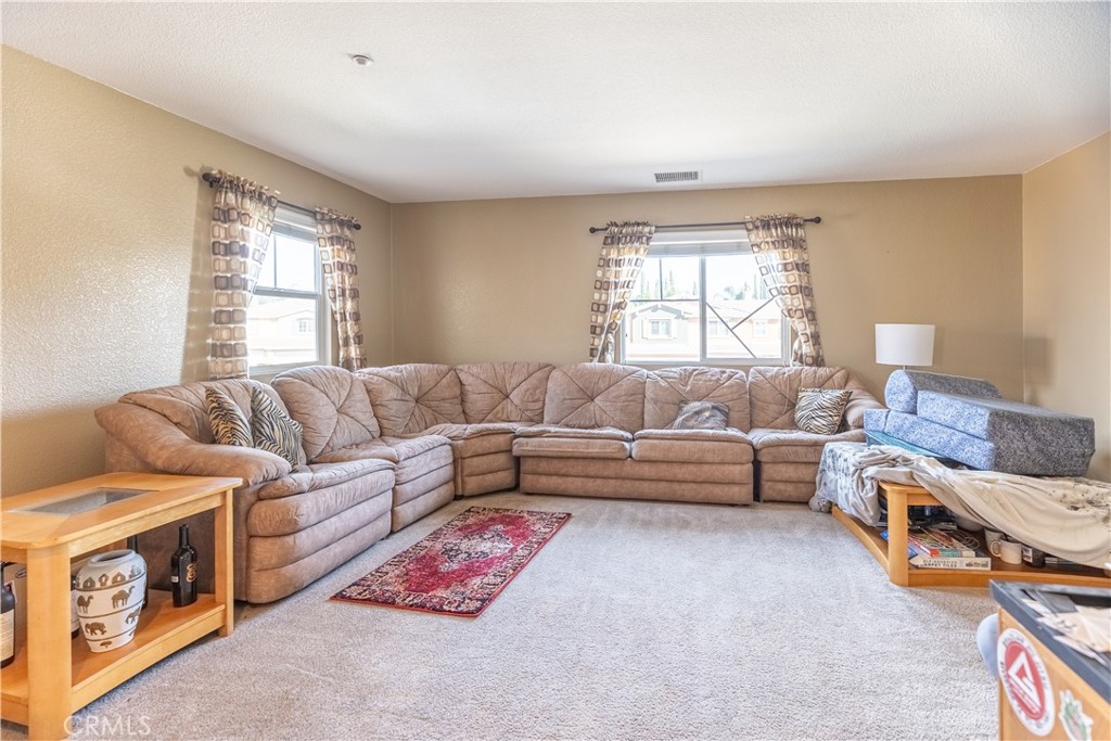 9131 Santa Barbara Drive Riverside, CA 92508 - Photo 4 of 29 a living room with furniture and a window