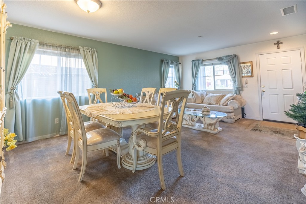 9131 Santa Barbara Drive Riverside, CA 92508 - Photo 7 of 29 a dining room with furniture and window