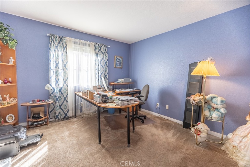 9131 Santa Barbara Drive Riverside, CA 92508 - Photo 9 of 29 a view of a workspace with furniture and a window