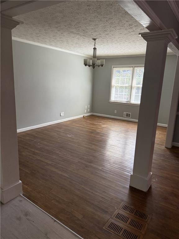 975 Ridgedale Drive Lawrenceville, GA 30043 - Photo 6 of 31 an empty room with wooden floor cabinet and windows