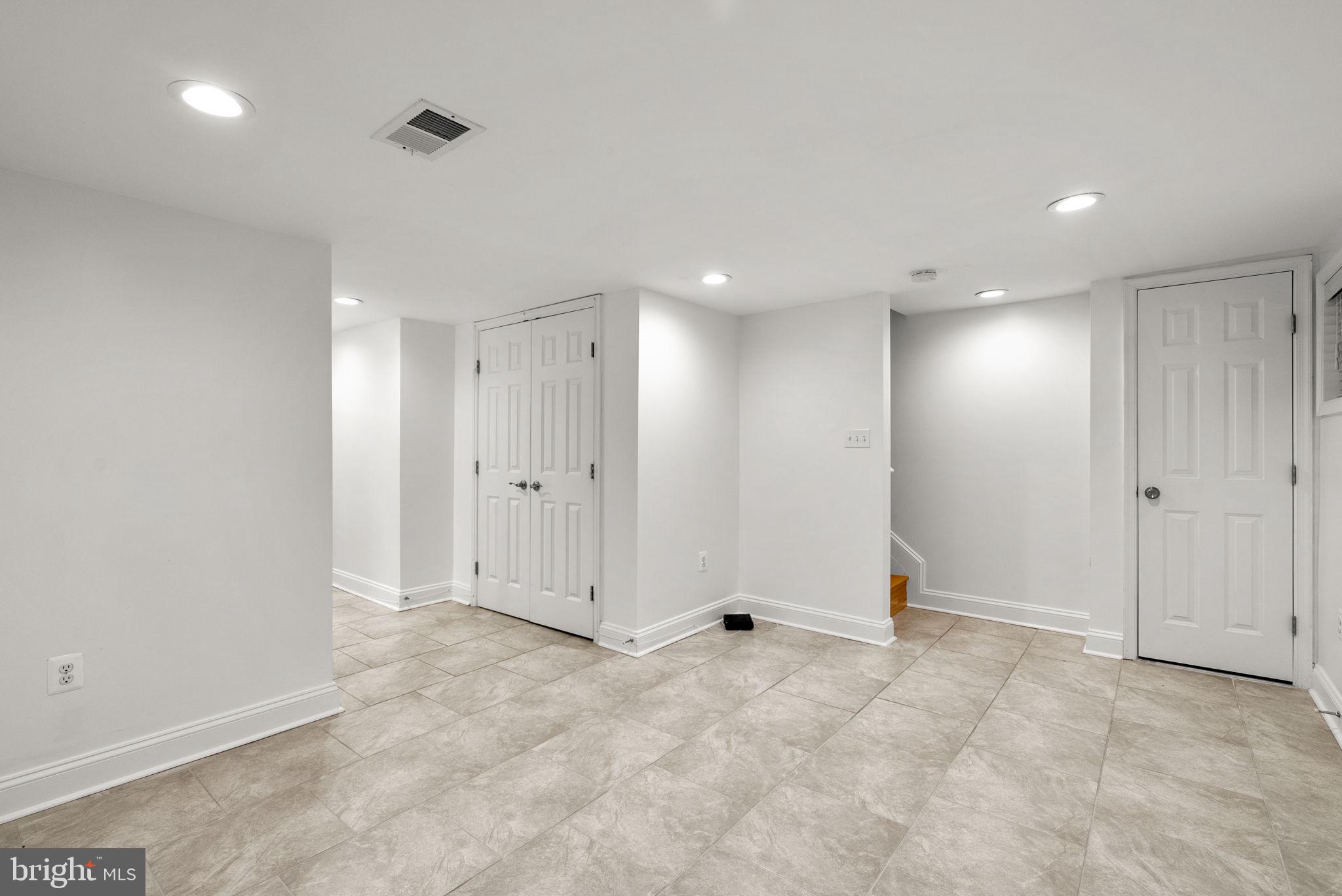 925 Decatur Street Northwest Washington, DC 20011 - Photo 29 of 41 Lower-level rec room with view to stairs