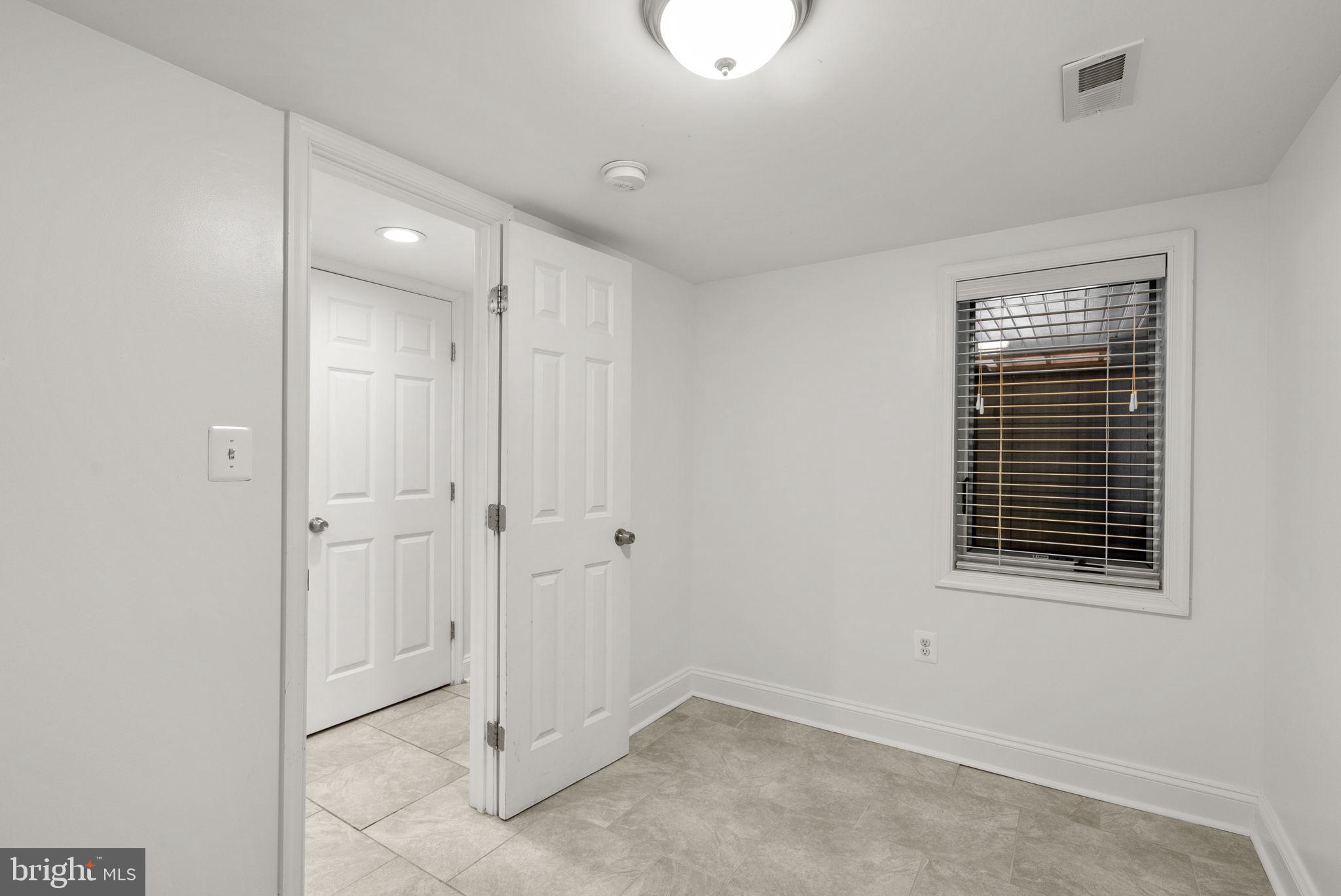 925 Decatur Street Northwest Washington, DC 20011 - Photo 32 of 41 Lower-level bedroom with egress window