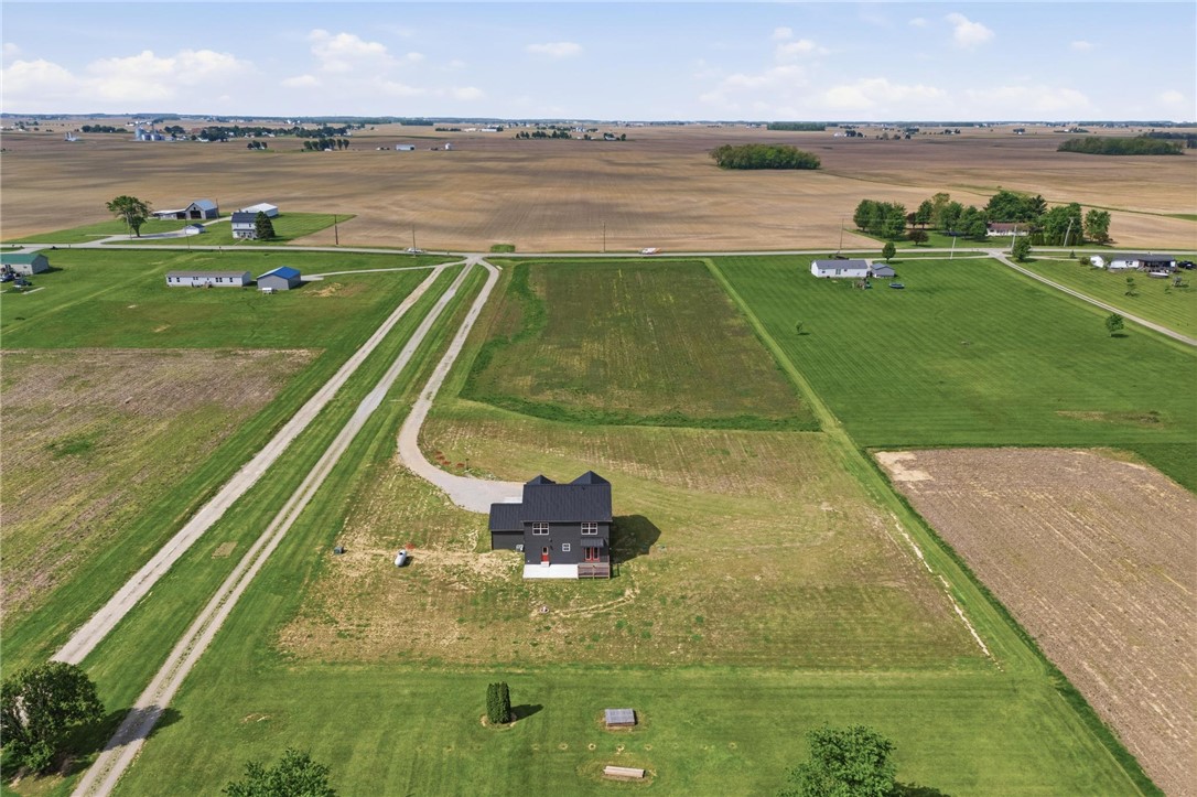 3509 South State Rte 72 Sabina, OH 45169 - Photo 37 of 44 Expansive rural property featuring a modern dwelling amidst vast open fields.