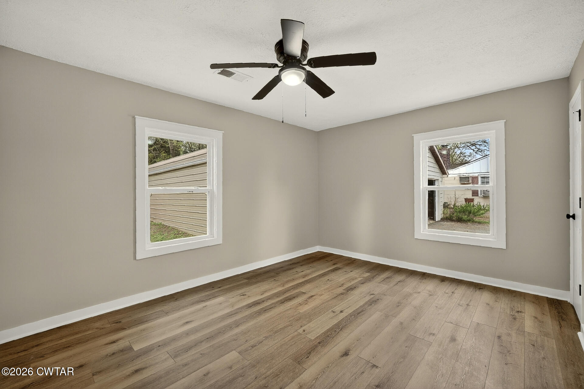 402 Harts Bridge Road Jackson, TN 38301 - Photo 12 of 38 a view of empty room with wooden floor