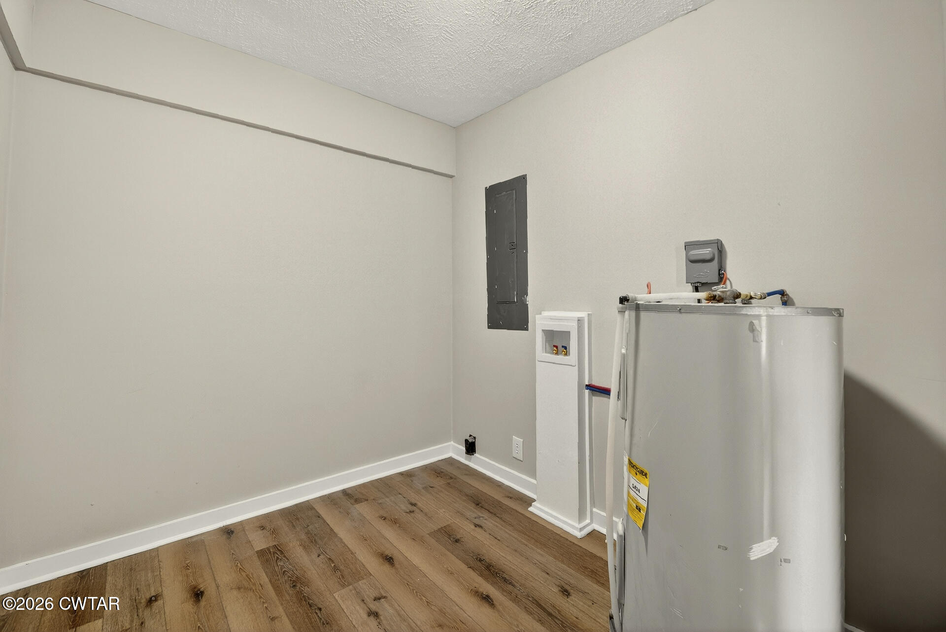 402 Harts Bridge Road Jackson, TN 38301 - Photo 20 of 38 a view of a storage & utility room with refrigerator