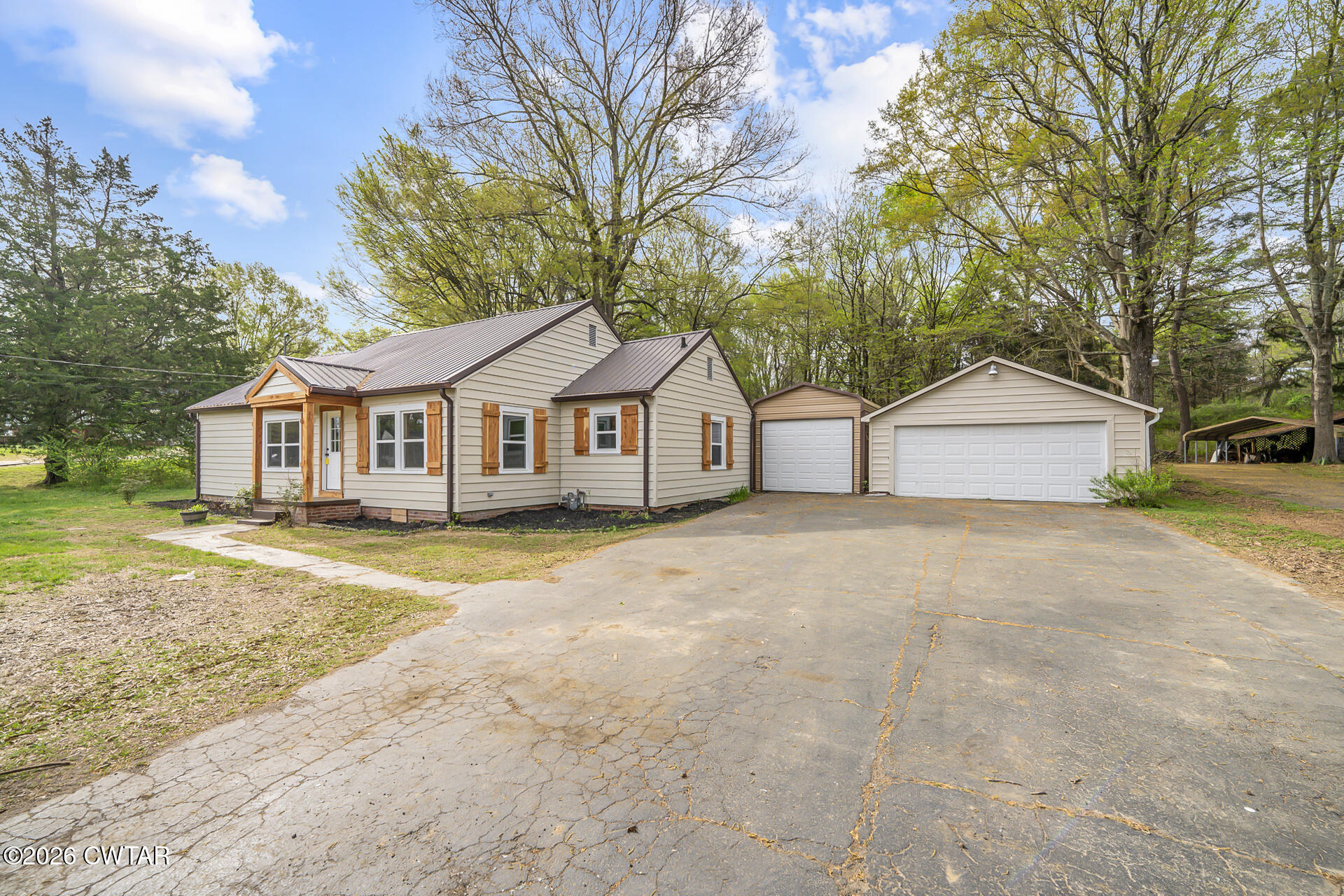 402 Harts Bridge Road Jackson, TN 38301 - Photo 2 of 38 a view of house with outdoor space and sitting area
