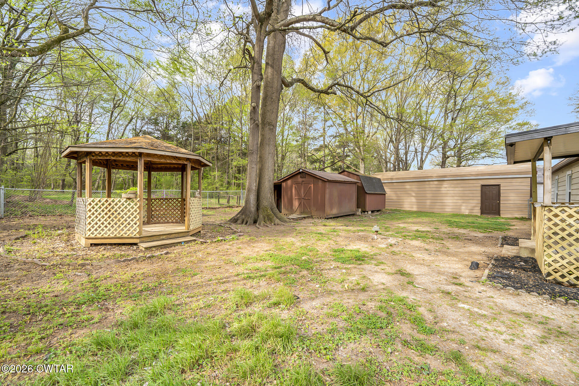 402 Harts Bridge Road Jackson, TN 38301 - Photo 24 of 38 a front view of a house with a garden