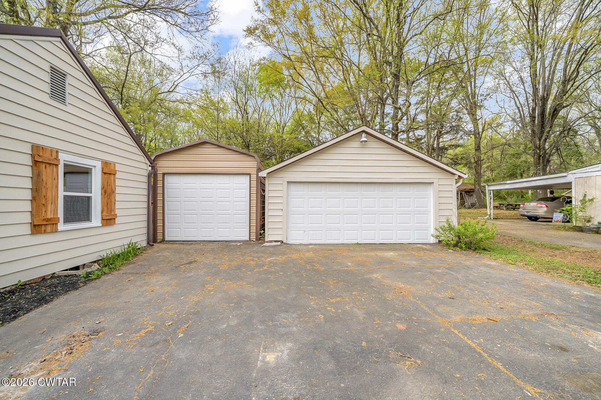 402 Harts Bridge Road Jackson, TN 38301 - Photo 29 of 38 a front view of a house with a yard and garage