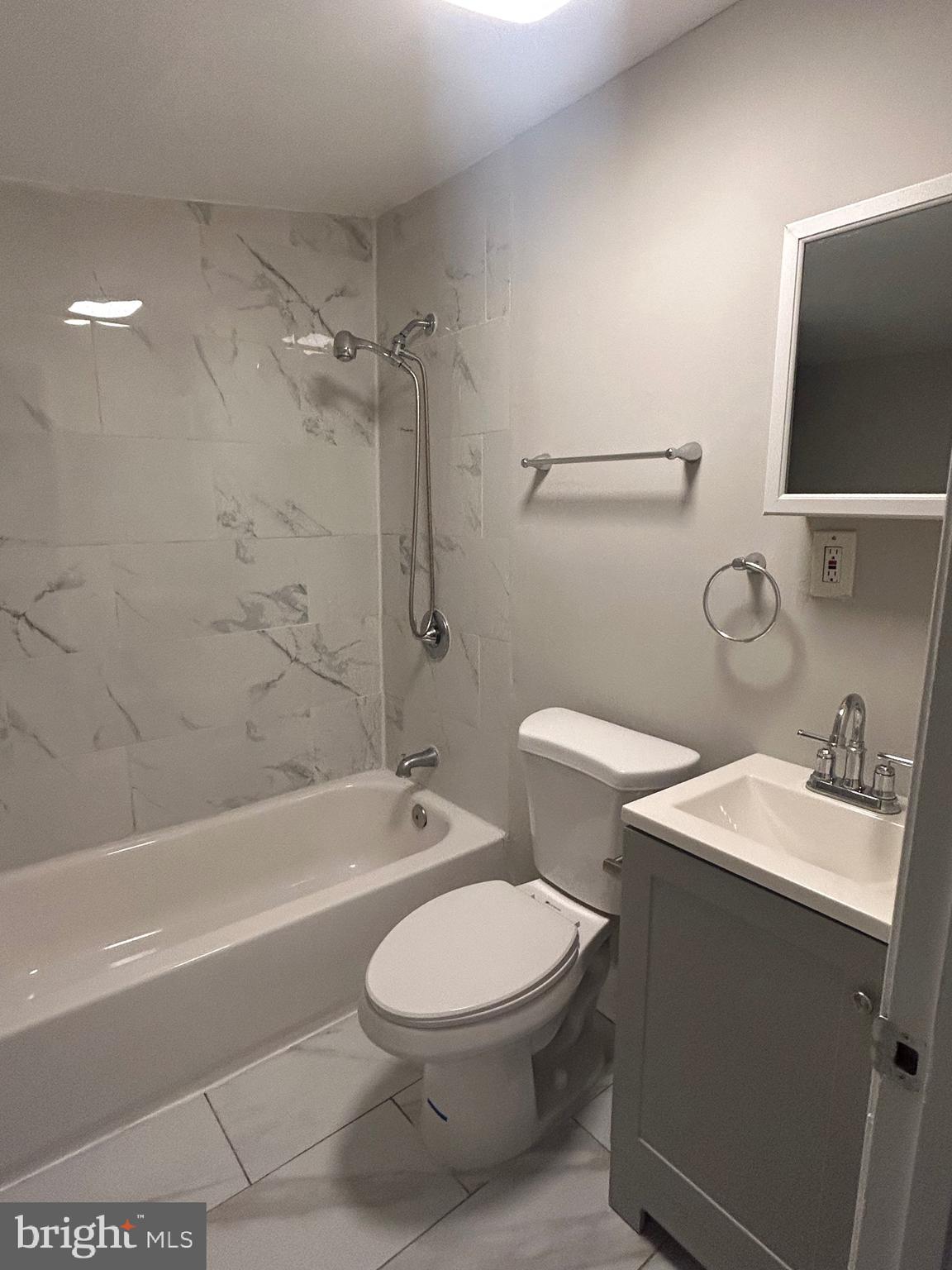 1807 Ramsay Street Baltimore, MD 21223 - Photo 12 of 13 a bathroom with a toilet a sink and bathtub