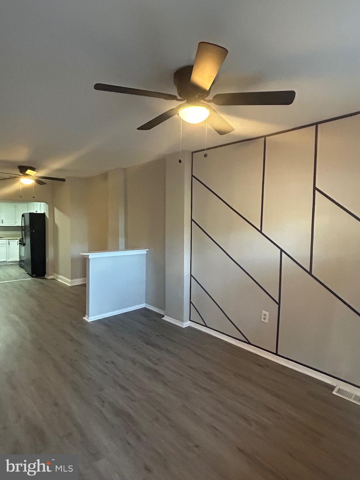 1807 Ramsay Street Baltimore, MD 21223 - Photo 2 of 13 a view of an empty room with wooden floor