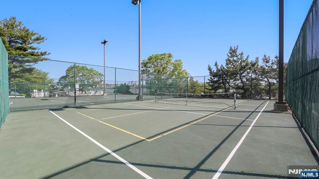 1077 River Road, Unit TH5 Edgewater, NJ 07020 - Photo 18 of 21 a view of a tennis court