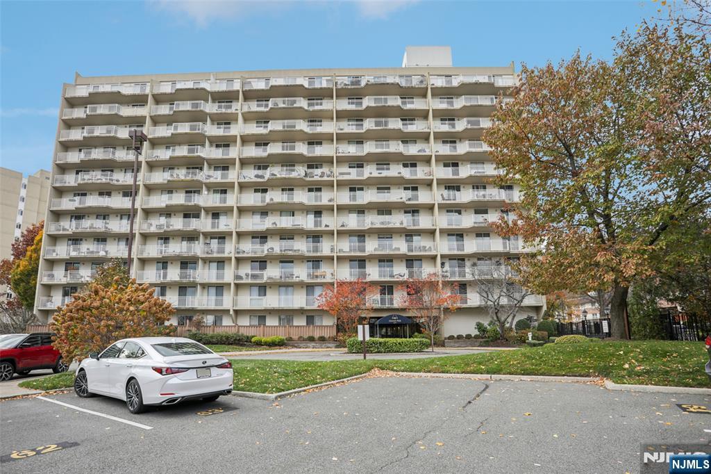 1077 River Road, Unit TH5 Edgewater, NJ 07020 - Photo 21 of 21 a front view of a building with cars parked