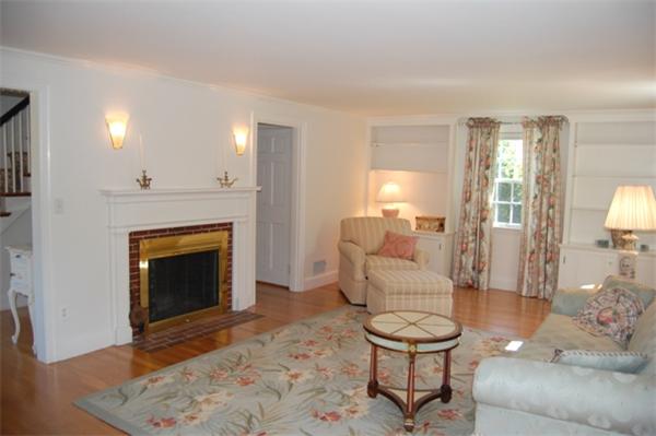32 Sherburne Road Lexington, MA 02421 - Photo 2 of 24 a living room with furniture and a fireplace