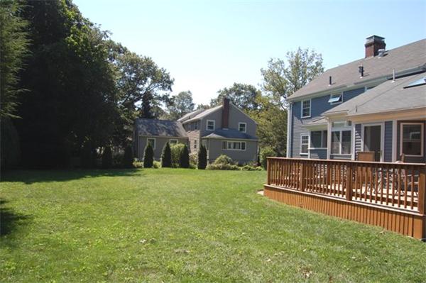 32 Sherburne Road Lexington, MA 02421 - Photo 21 of 24 a view of a house with a yard and a deck